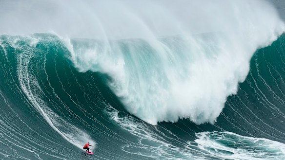 No chance: Maya Gabeira from Brazil rides a wave during the Nazare Big Wave Challenge surfing tournament at Praia do Norte in Portugal. Walsh headed further afield to find a more “manageable” wave to surf.