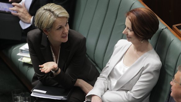 Tanya Plibersek and Julia Gillard during question time in Parliament in 2012.
