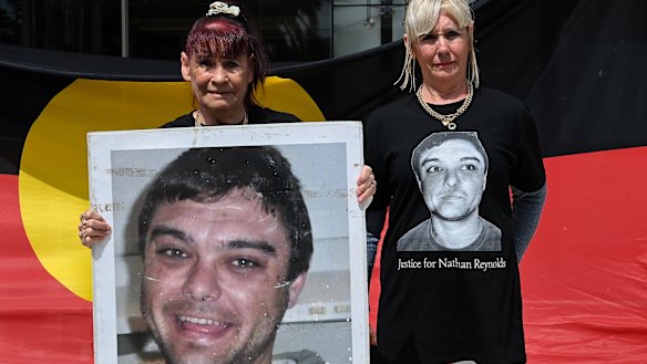 The family of Nathan Reynolds ... his grandmother Toni Reynolds (left) and Nathan’s mother Jodie Reynolds outside the Coroner’s Court at Lidcombe. 
