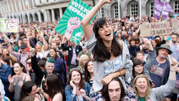 Ecstatic 'Yes' vote supporters celebrate in Dublin. 