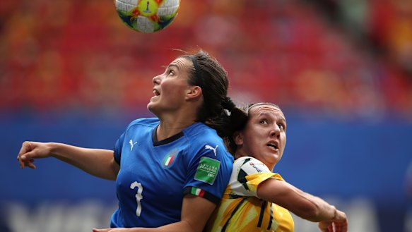 Australia's Lisa De Vanna, right, challenges Italy's Alia Guagni, left.