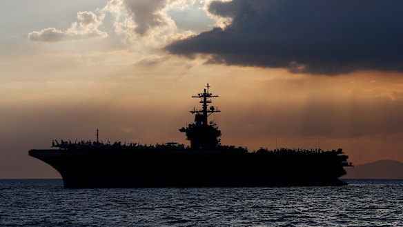 The USS Theodore Roosevelt aircraft carrier is anchored off Manila Bay in 2018.