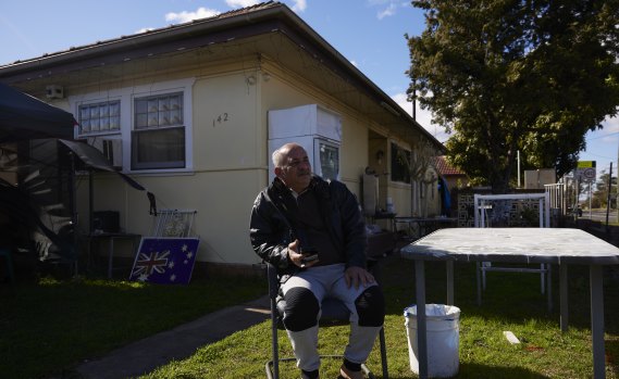Ramzi sits in front of his Fairfield home on Saturday morning during lockdown.