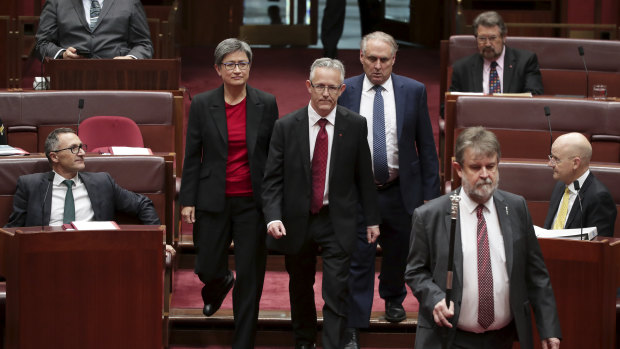 ACT Senator David Smith, flanked by senators Penny Wong and Don Farrell, has been sworn-in.