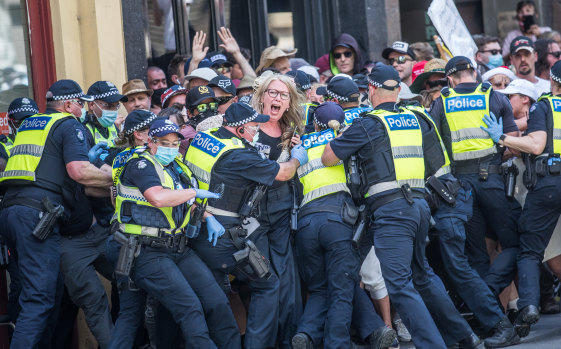 Police encircle protesters as tensions flare at a lockdown protest on November 3.