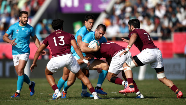 Nothing left: Uruguay fought an uphill battle against Georgia, four days after their upset win over Fiji.