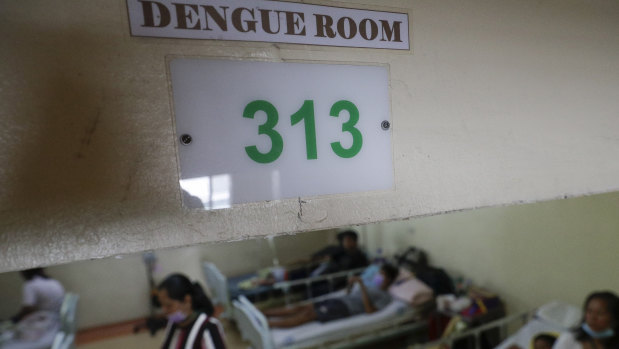 Dengue patients and relatives stay at the dengue room inside the San Lazaro government hospital in Manila on Wednesday.