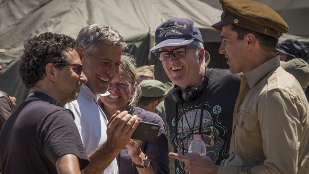 Directors Grant Heslov, George Clooney, Ellen Kuras, star Christopher Abbott with Davies on set.