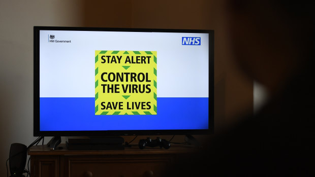 The government's new slogan "Stay Alert, Control the Virus, Save Lives" is seen during Britain's Prime Minister Boris Johnson's televised message to the nation.