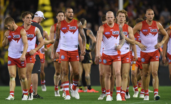 Swan dive: Sydney players come to terms with another defeat.