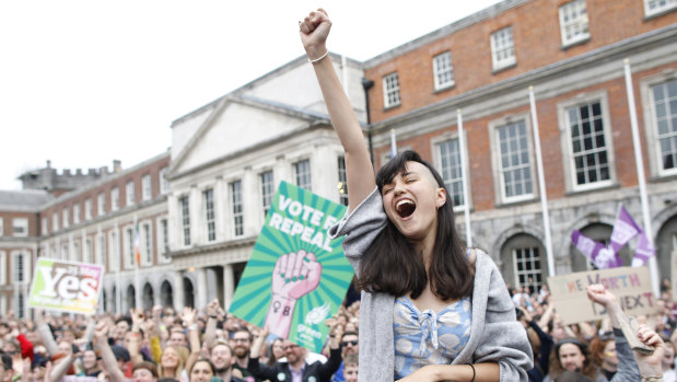 A woman at Dublin Castle reacts to the vote to repeal the 8th Amendment of the Irish Constitution, which banned abortion.