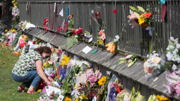 A floral tribute on the fence of the Christchurch Botanic Gardens.