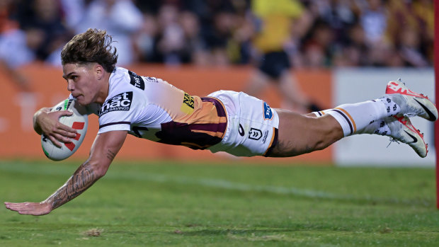 Walsh crosses against the Tigers in Campbelltown. Fans waited for more than an hour after the game to meet Brisbane’s stars.