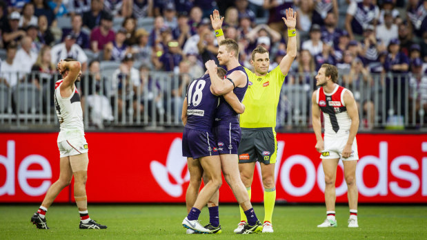 The Dockers celebrate their narrow win over St Kilda.