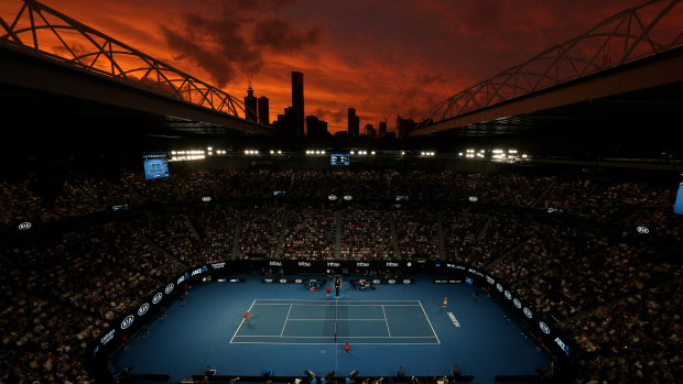 Red sky night: Sunset over Rod Laver Arena in Melbourne during tonight's third-round match.
