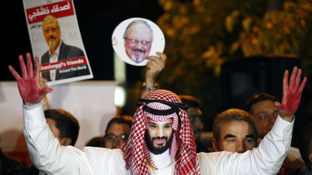 An activist wearing a Bin Salman maks during a candlelight vigil for Saudi journalist Jamal Khashoggi outside Saudi Arabia's consulate in Istanbul.
