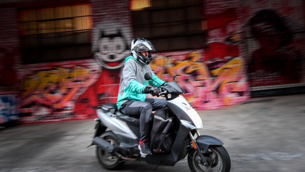 A delivery driver leaves Deliveroo's dark kitchen. 