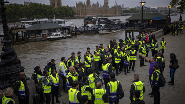 Security workers wait to be deployed around central London.