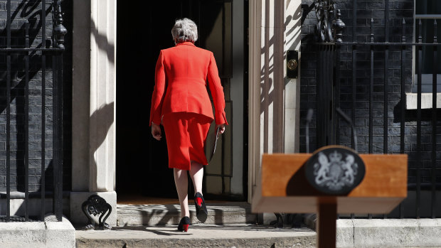 British Prime Minister Theresa May walks away after making a speech in the street outside 10 Downing Street.