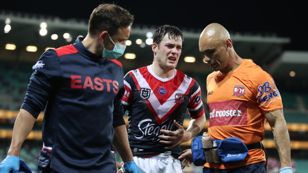 Luke Keary is helped from the field on Thursday.