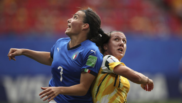 Australia's Lisa De Vanna, right, challenges Italy's Alia Guagni, left.