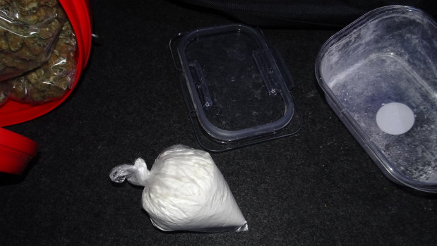 Police seized drugs, weapons and cash in a Gungahlin search on Tuesday night.