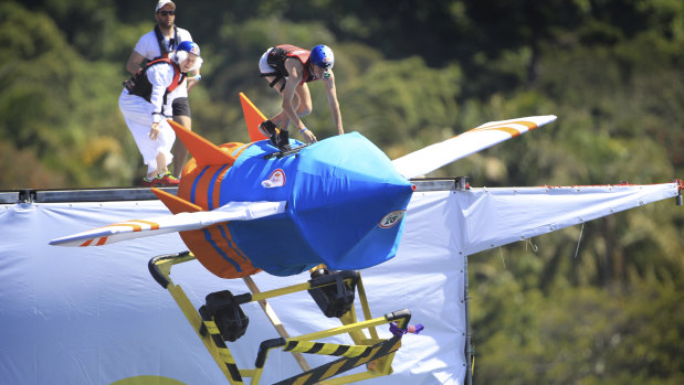 Contestants soar through the Red Bull Flugtag event on homemade contraptions.