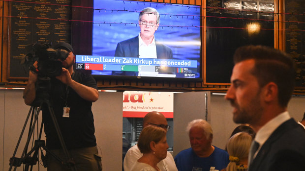 Zak Kirkup mingles with Liberal supporters after conceding while former leader Mike Nahan dissects the result on television.