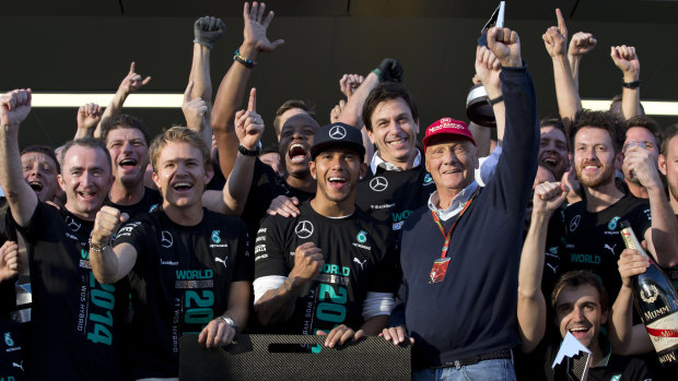 Lewis Hamilton and Niki Lauda with their Mercedes teammates in 2014.