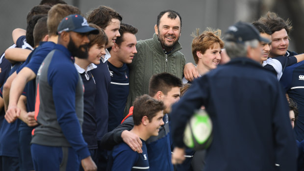 Hearts and minds: Melbourne Grammar School students lapped up a visit from the Wallabies on Thursday. 