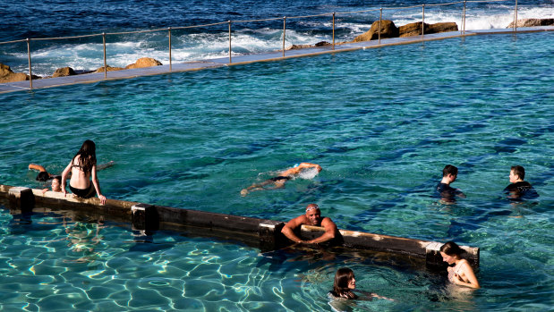 Swimmers enjoy the winter sunshine at Bronte Pool, Sydney.
