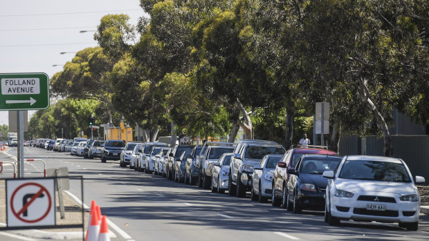 Vehicles queue as they wait for a COVID-19 test in Adelaide. 