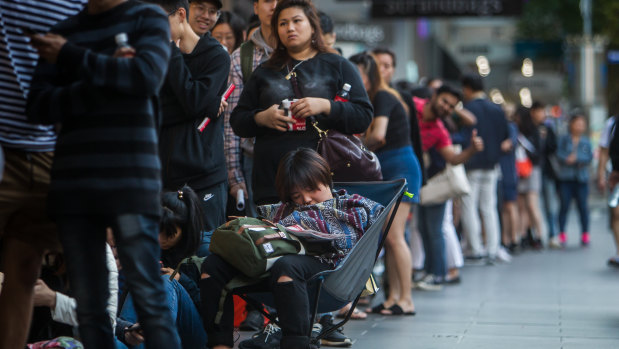Lining up for bargains across Australia: Shoppers at a David Jones queue on Wednesday morning.