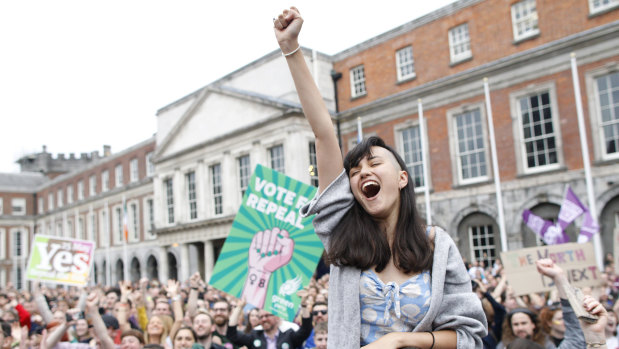 A woman at Dublin Castle reacts to the vote to repeal the 8th amendment of the Irish constitution, which banned abortion.