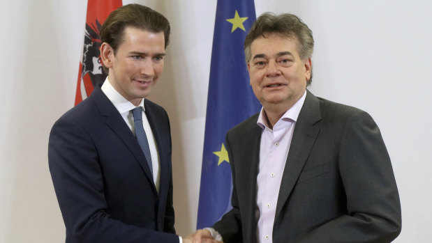 Sebastian Kurz, left, head of the Austrian People's Party, shakes hands on a coalition deal with Werner Kogler, head of the Austrian Greens. The deal will likely see Kurz back at the helm.