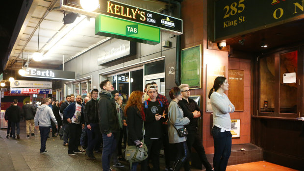 Punters line up to enter Newtown bar Kelly's on King.