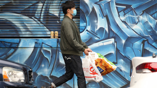 A shopper wearing a face mask in Melbourne's CBD.