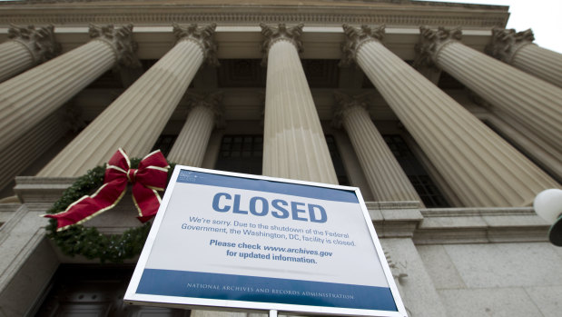 A closed sign is displayed at The National Archives entrance in Washington.