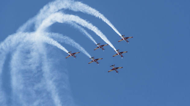 RAAF Roulettes put on a display over the lawns of Parliament House.