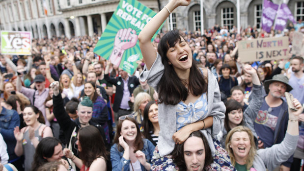 Ecstatic 'Yes' vote supporters celebrate in Dublin. 