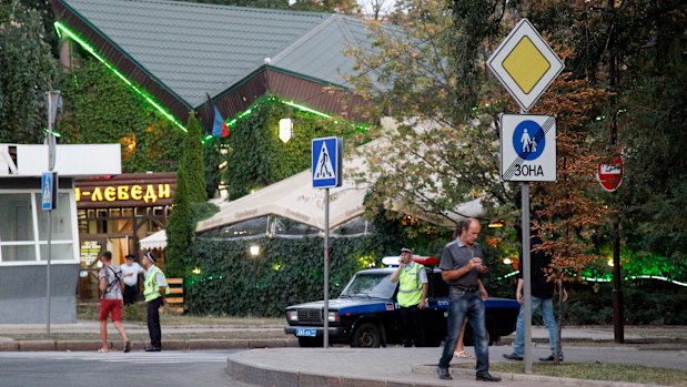 Policemen block traffic close to the site of the murder of Alexander Zakharchenko in Donetsk on Friday.