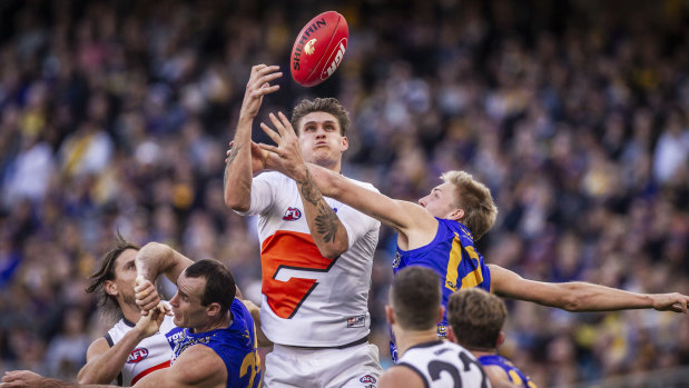Eyes on the prize: GWS forward Rory Lobb rises above the pack.