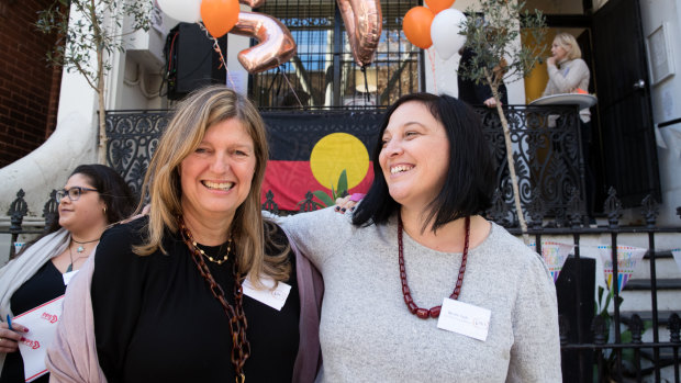 Lou's Place general manager Nicole Yade, right, and the organisation's chair Alexa Haslingden celebrate 20 years of the refuge in 2019.
