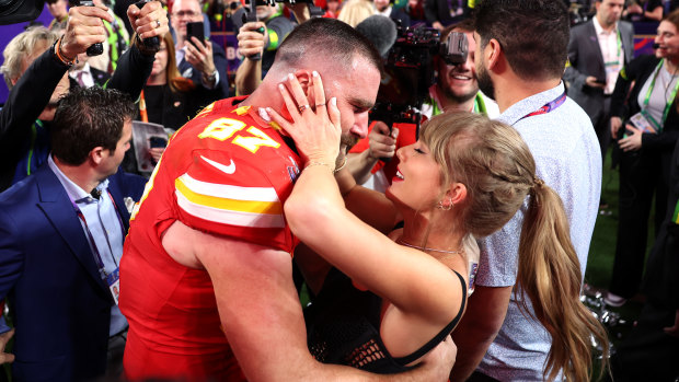 Kansas City Chiefs tight end Travis Kelce celebrates with Taylor Swift after his team won the Super Bowl.
