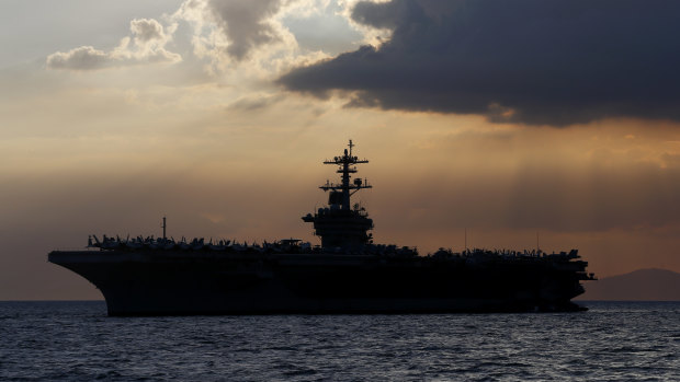 The USS Theodore Roosevelt aircraft carrier is anchored off Manila Bay in 2018.