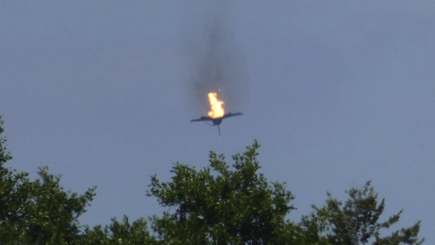 A burning Eurofighter plane crashes down near the village Malchow in northern Germany.
