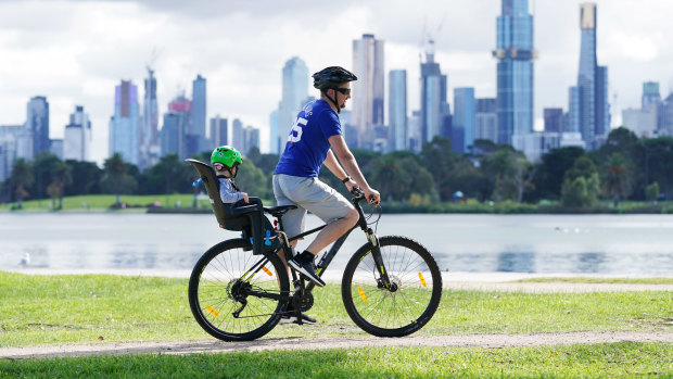 People exercise at Albert Park Lake in Melbourne.