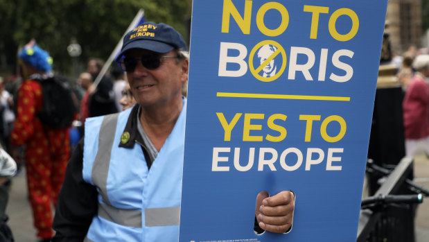Anti-Brexit supporters take part in a protest at College Green near the Houses of Parliament.