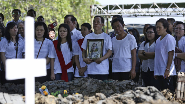 Mourners remember the victims of last year's church attacks in Surabaya.