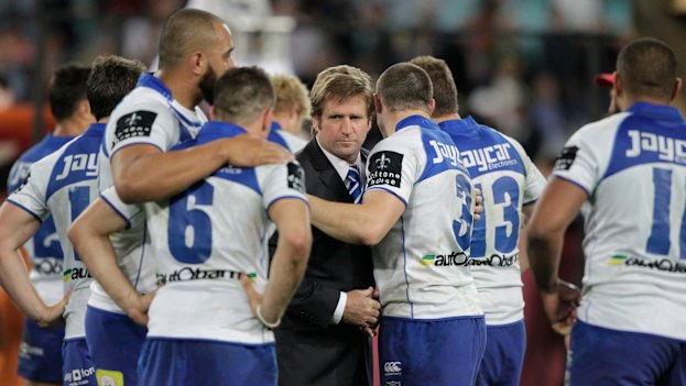 Des Hasler consoles the players after the heartache of the 2012 grand final loss to Melbourne.